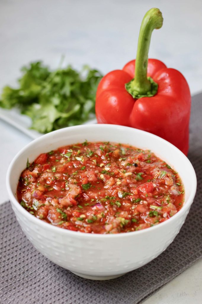 This secret ingredient salsa is filled with fresh ingredients bursting with authentic flavor. Throw everything into a blender and have on the table in 10 minutes or less! Vegan and gluten-free.