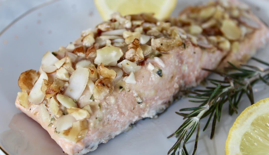 This simple nut-crusted salmon takes just 5 minutes to whip up and is on the table in under 30 minutes! The honey mustard glaze topped with nuts is the perfect combination of sweet and savory