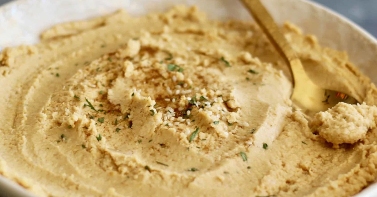 Whip up this healthy peanut butter hummus in 10 minutes or less with ingredients right from your pantry. No tahini needed!