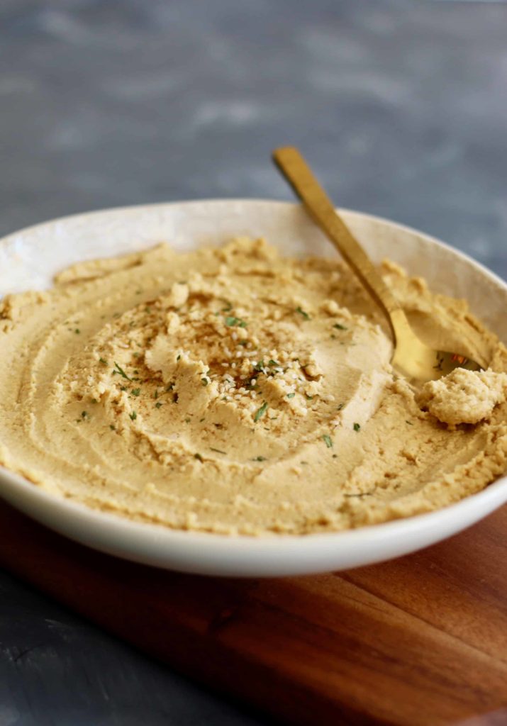 Whip up this healthy peanut butter hummus in 10 minutes or less with ingredients right from your pantry. No tahini needed!