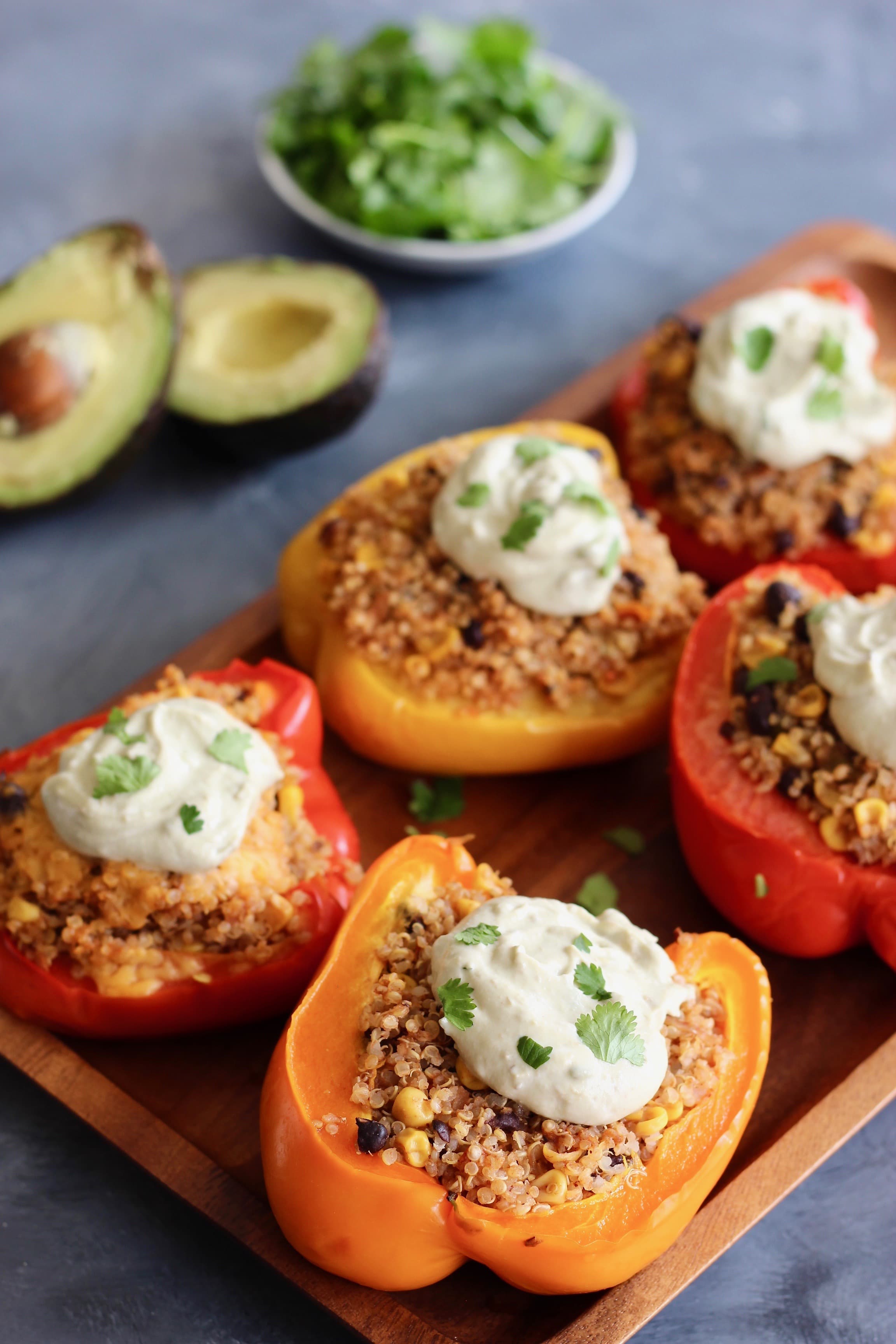 Mexican Quinoa Stuffed Peppers with Yogurt Avocado Sauce