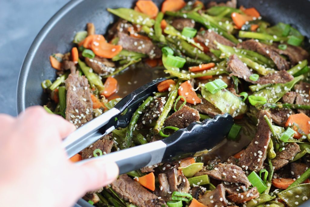 Incorporate seasonal ingredients like carrots, peas, and asparagus into this super quick Vegetable and Flank Steak Stir Fry. A perfect protein and veggie-packed recipe to whip up for your next meal. 