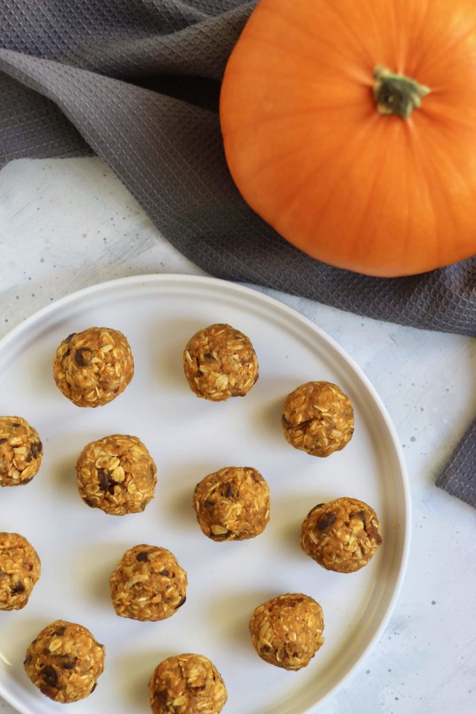 These seasonal pumpkin energy bites are a perfect snack to make for a busy week or holiday party. They are customizable and take 5 minutes or less to make! #vegan #glutenfree #energybites #pumpkinrecipes #healthysnack #CheerfulChoices