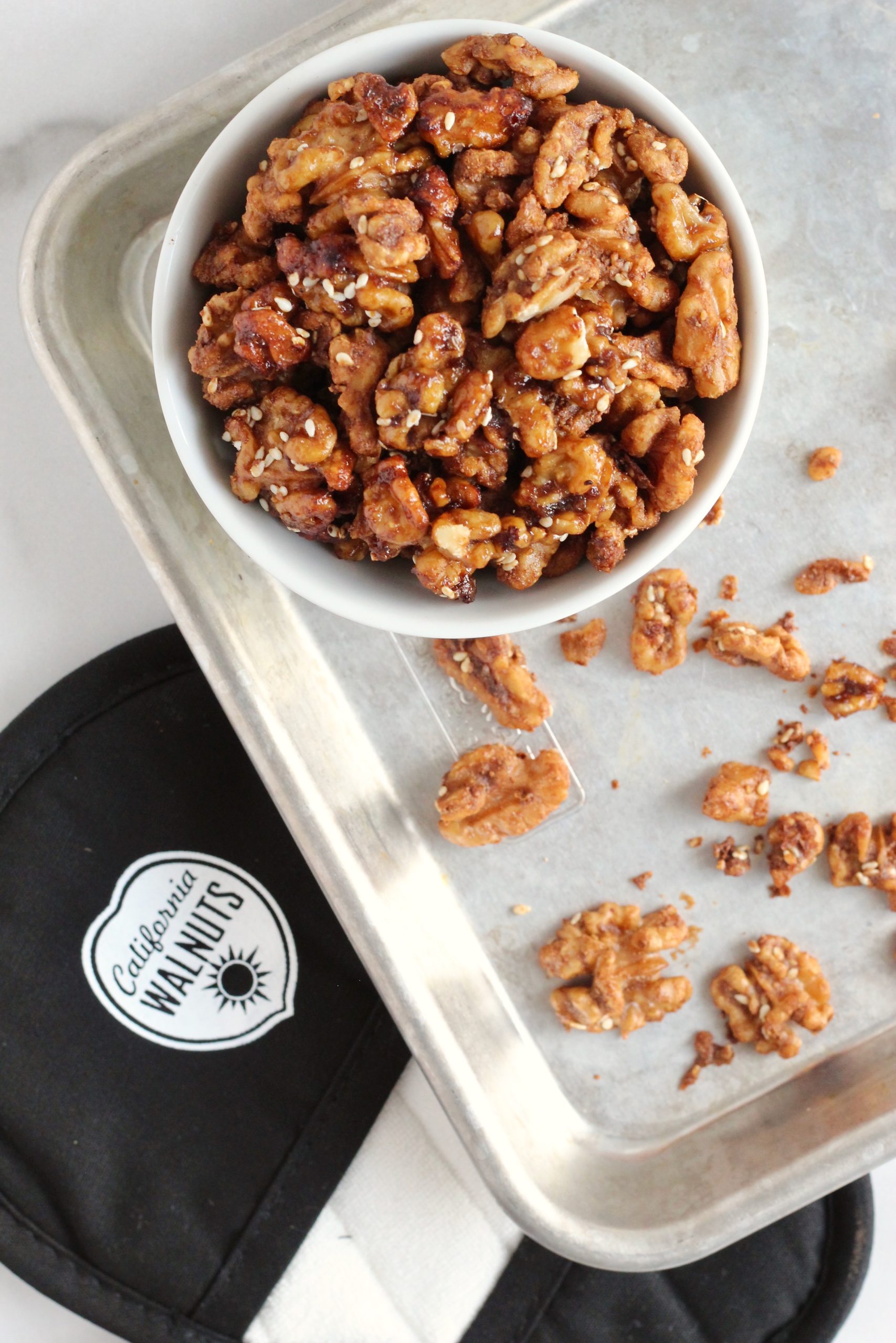 These crunchy soy glazed walnuts are the perfect savory bite to snack on at home. They are seriously so easy to make and call for just a few simple pantry ingredients and spices. Recipe includes vegan and gluten-free friendly options. #PantryRecipe #Sponsored #WalnutsSweetOrSavory @CaWalnuts
