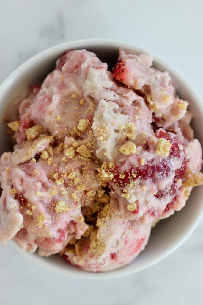 Strawberry Cheesecake Nice Cream is the perfect healthier recipe to fix your sweet craving. This dessert is naturally sweetened from fruit and takes just a few minutes to blend up. #NiceCream #StrawberryCheesecake #HealthyDessert