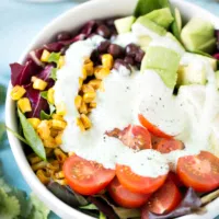 southwest salad topped with jalapeno ranch greek dressing