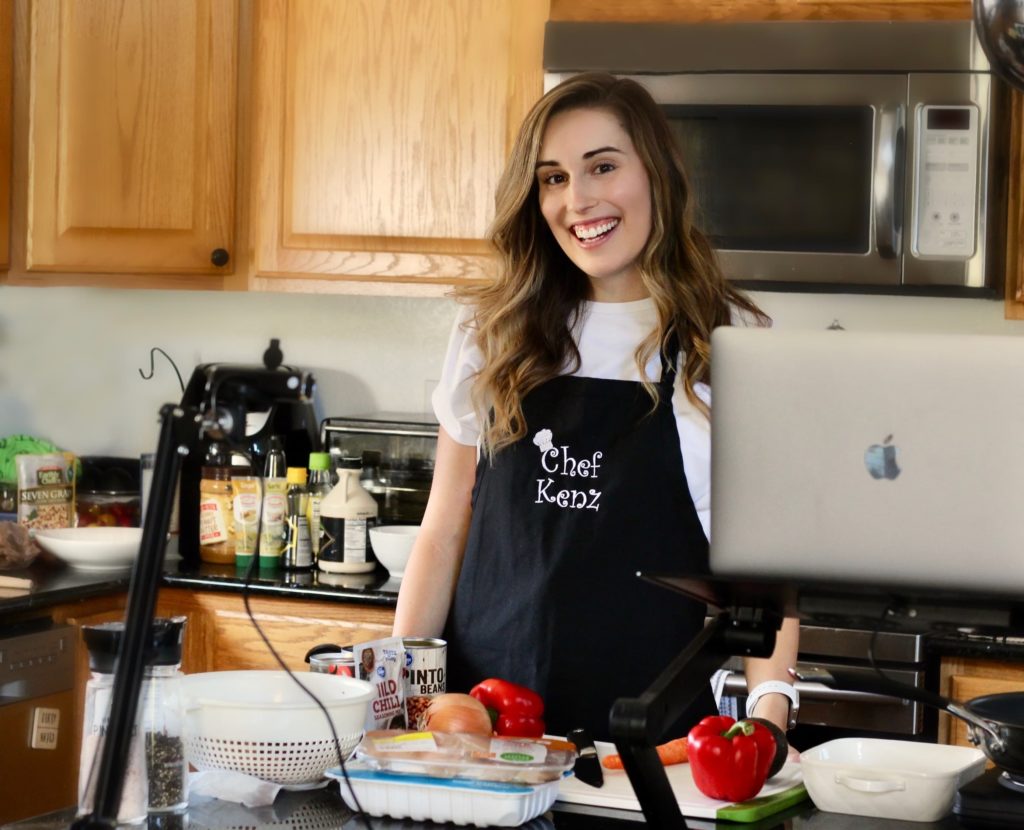 Mackenzie in the kitchen teaching Virtual Nutrition Coaching and Cooking Classes