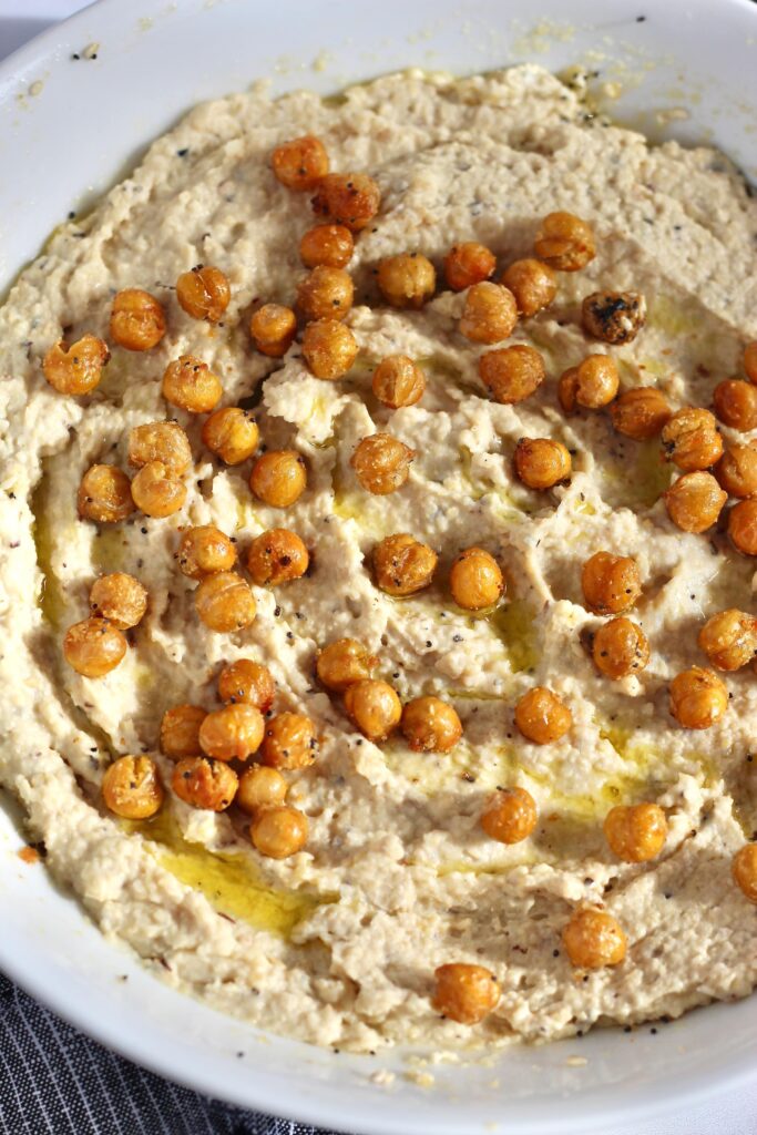 Roasted air fried chickpeas added over homemade hummus