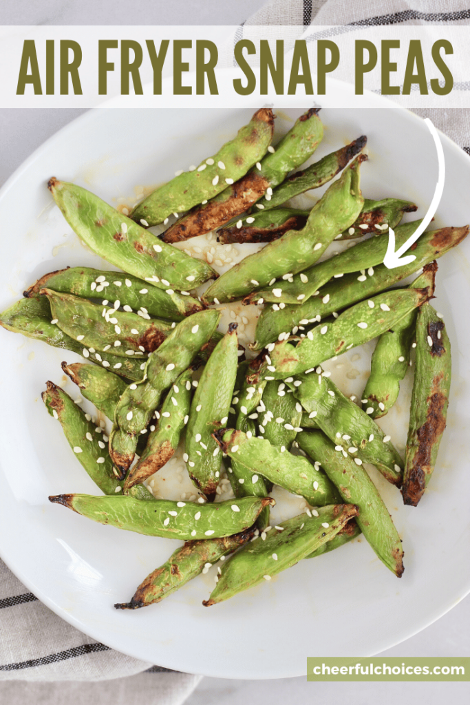 Air Fryer Snap Peas are the perfect savory and satisfying snack. This healthy recipe calls for just 2 ingredients and is less than 100 calories per serving. #HealthySnacks #SugarSnapPeas #AirFryer #TeriyakiSauce