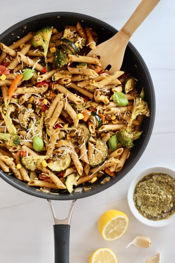 Penne pasta and vegetables in a large pan