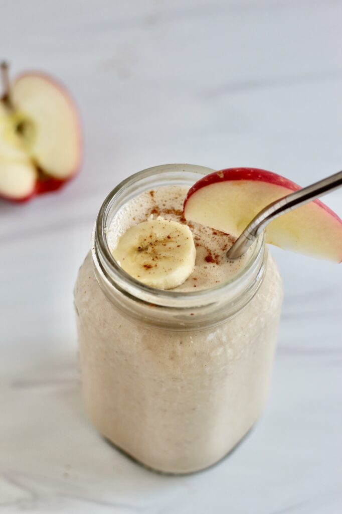 Apple banana smoothie with cinnamon sprinkled on top