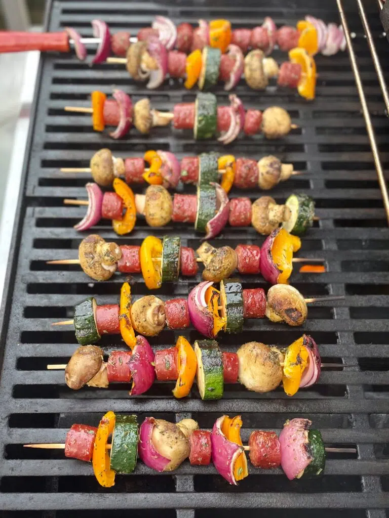 Colorful sausage kabobs on the grill