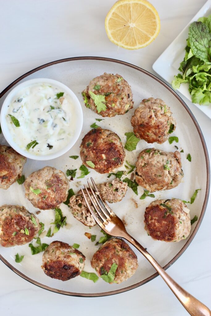 Lamb meatballs with a gold fork