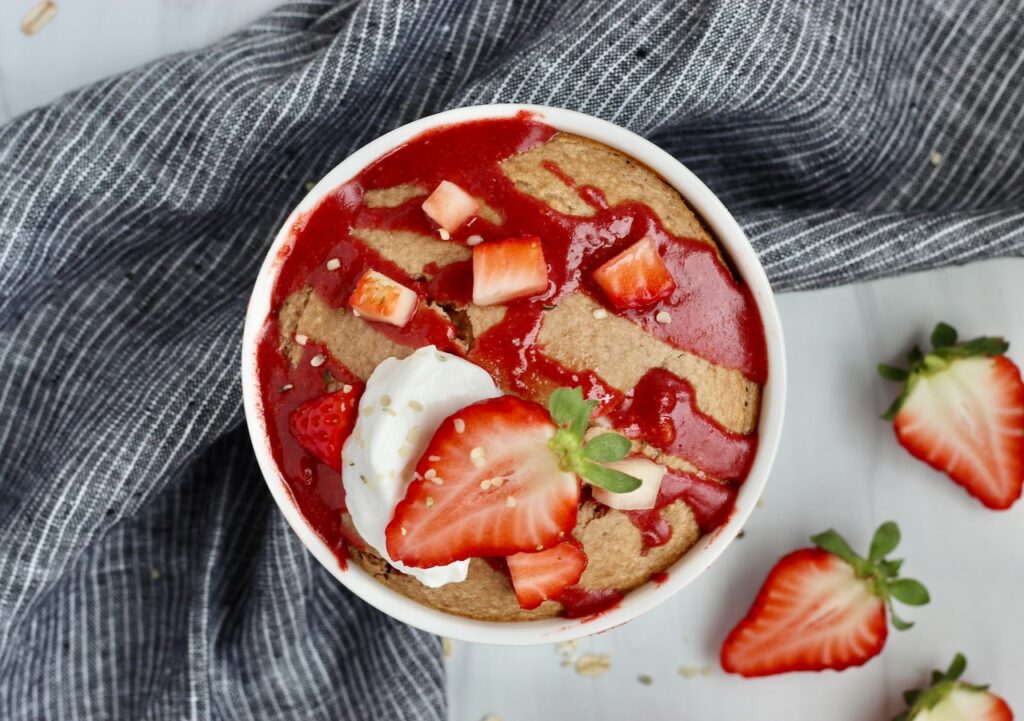 strawberry baked oatmeal with whole strawberries on top