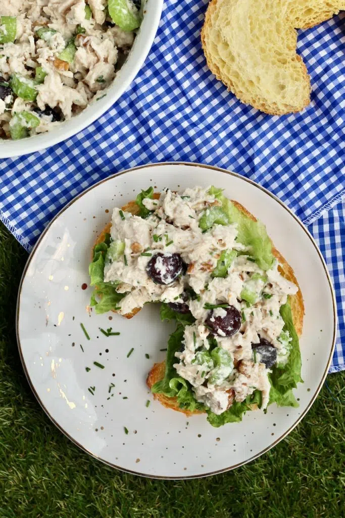 Chicken salad with herbs served over a croissant 