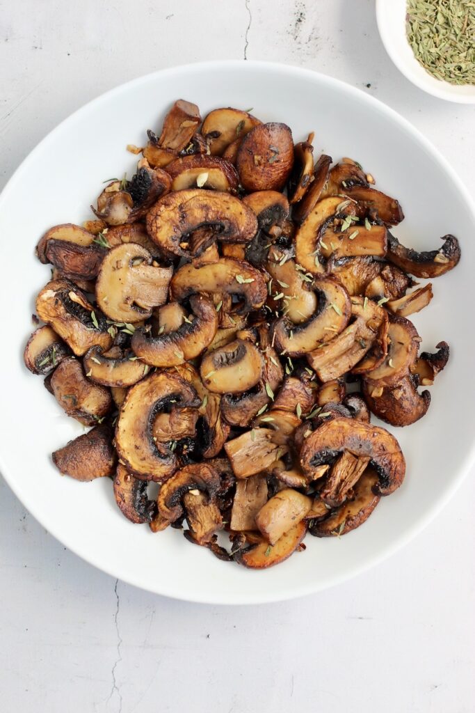 Caramelized mushrooms in a white bowl
