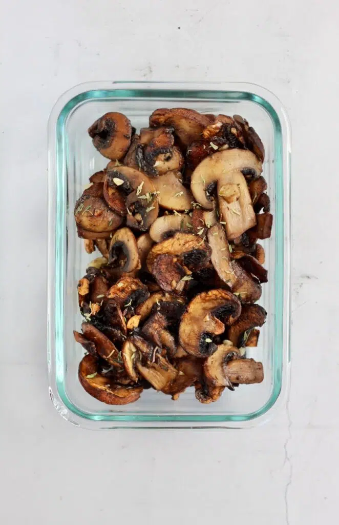 Meal prep container with sliced and cooked mushrooms inside