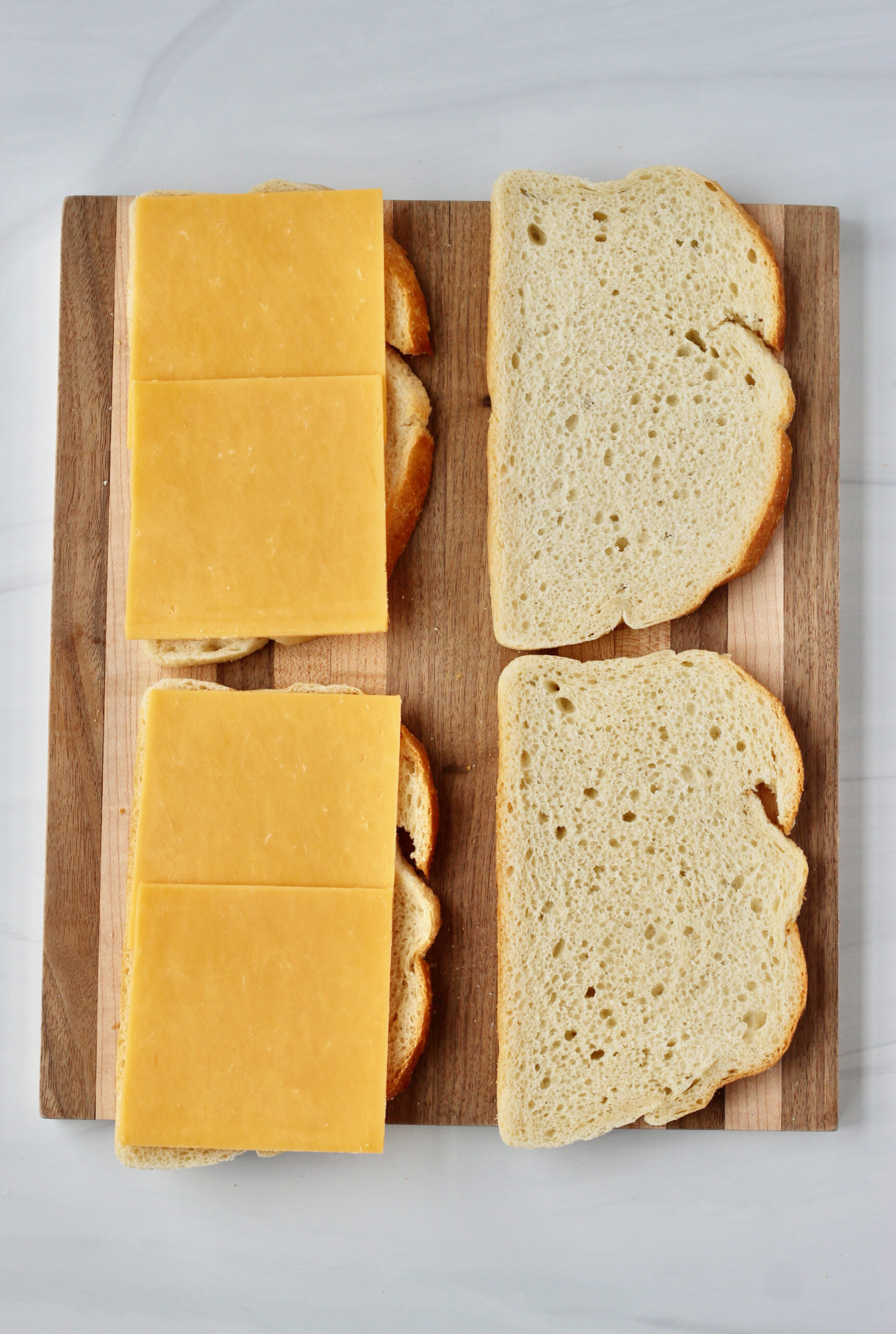 2 slices of cheese added to bread