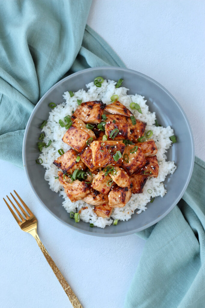 Air fryer salmon bites served over rice