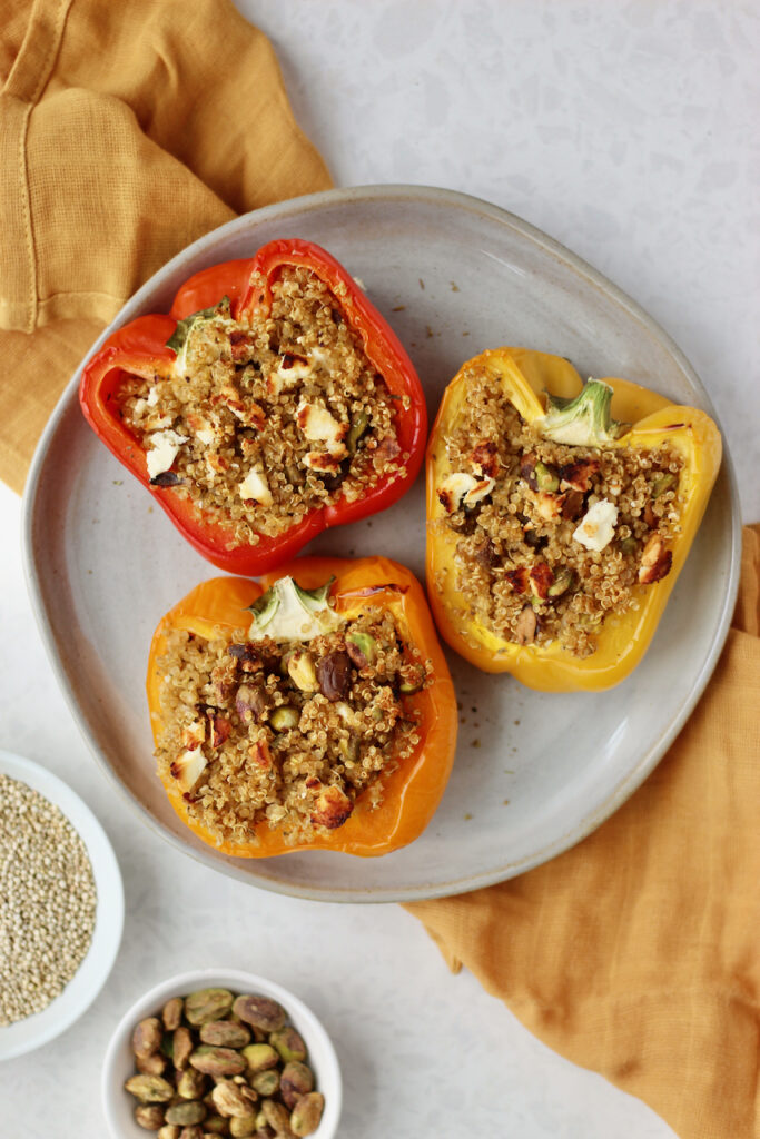 Stuffed Peppers on a plate over a yellow kitchen towel