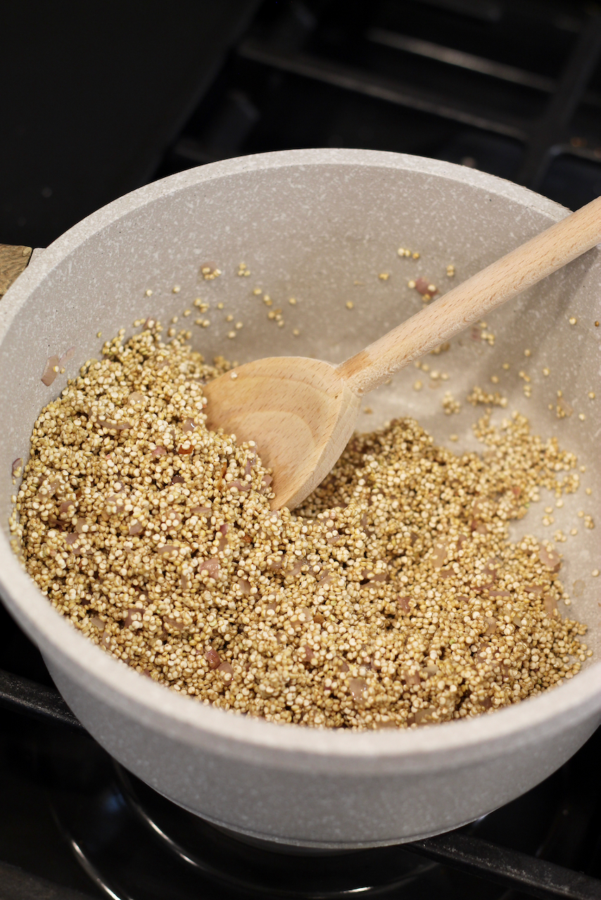 Toasting quinoa in a pan