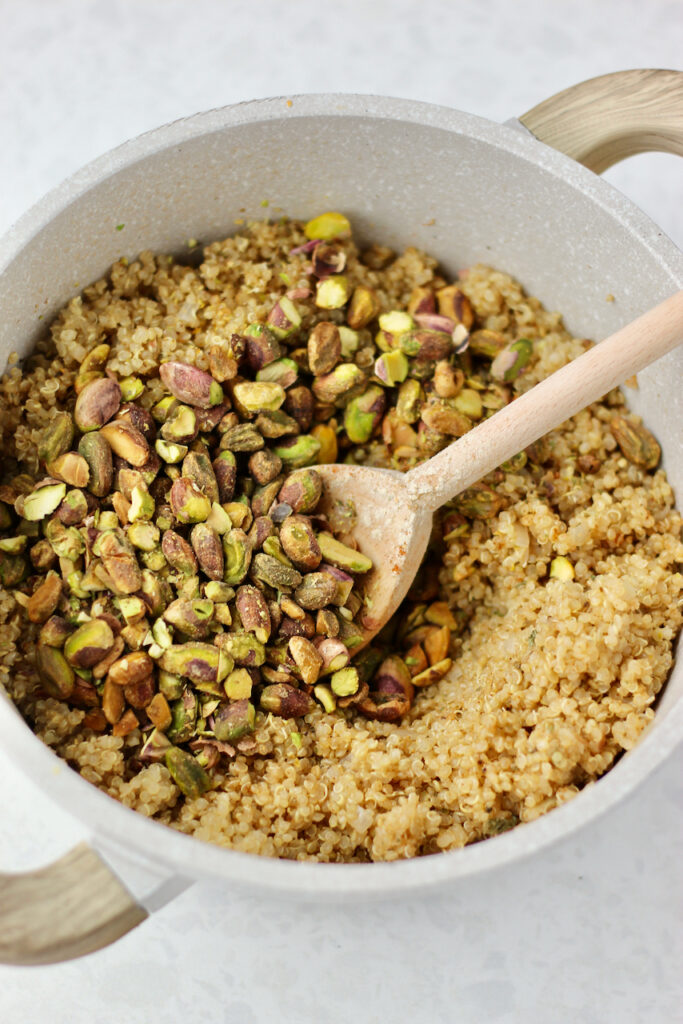 Cooked quinoa with pistachios stirred in