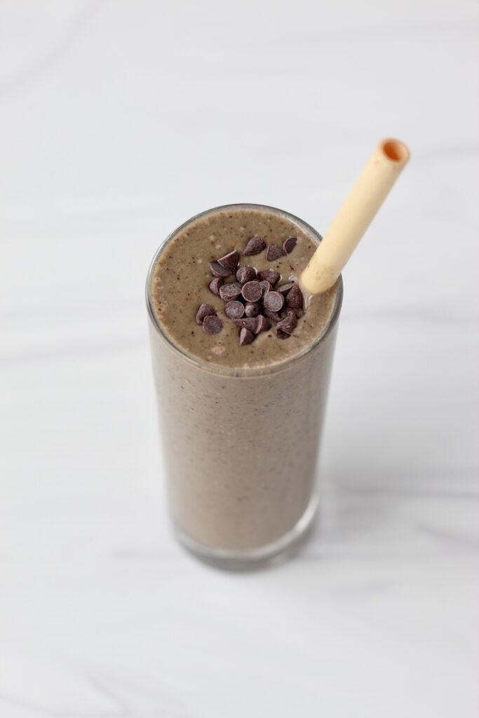 Chocolate smoothie with bamboo straw