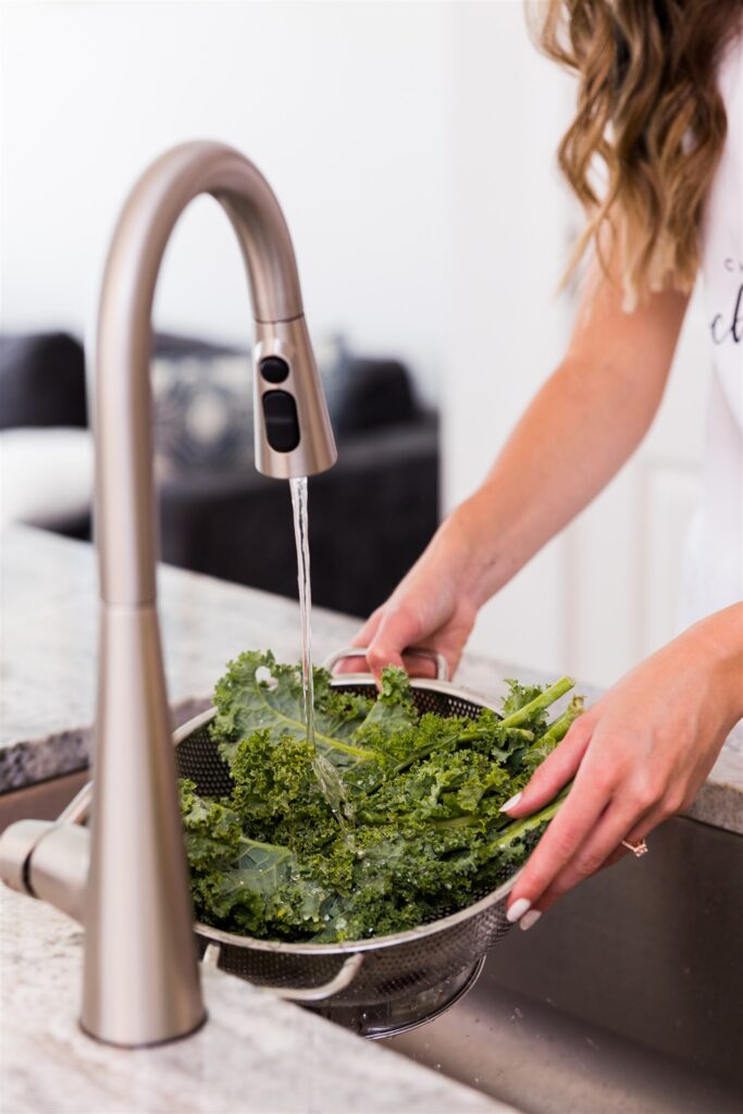 Washing kale under kitchen faucet
