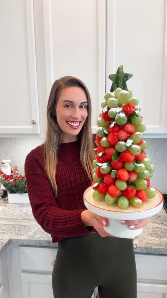 Mackenzie Burgess holding up fruit tree recipe
