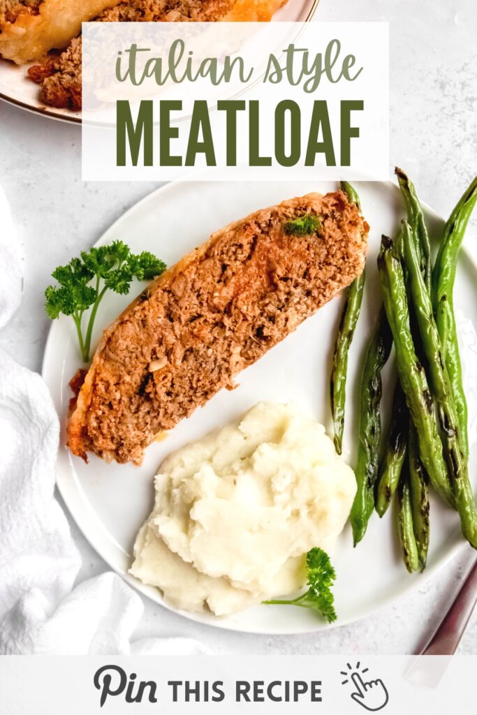 Slice of meatloaf next to blistered green beans and mashed potatoes
