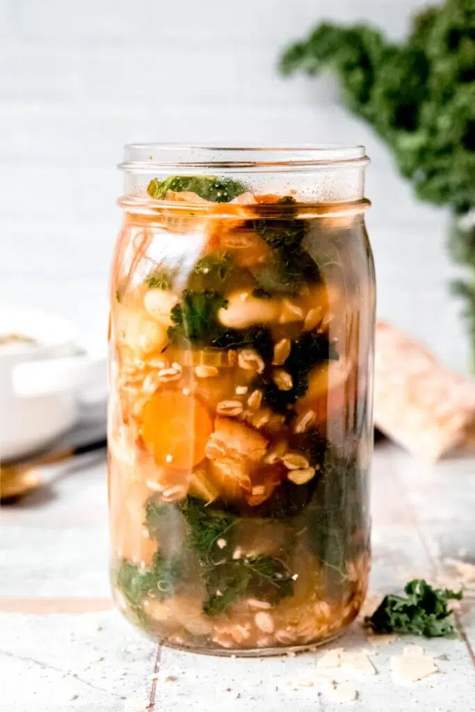 Nutritious and filling white bean soup with farro stored in a mason jar