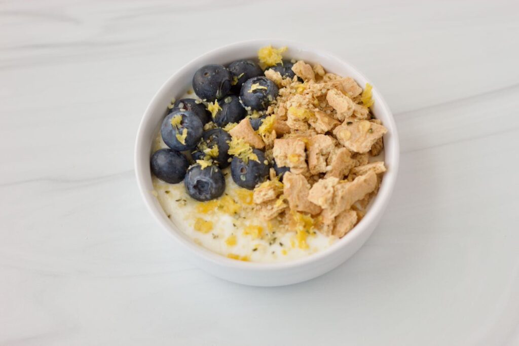 Side view of protein yogurt bowl with berries on top