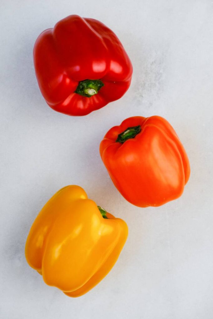A red, orange, and yellow bell pepper