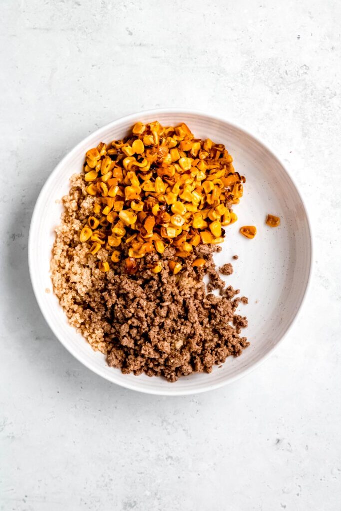 Quinoa, ground beef, and corn on white plate