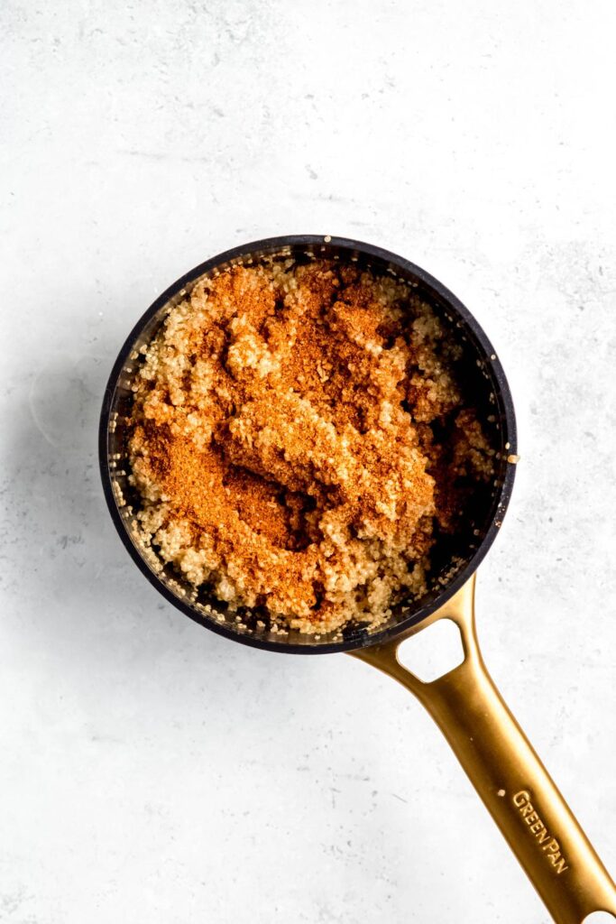 Quinoa combined with taco seasoning in pot