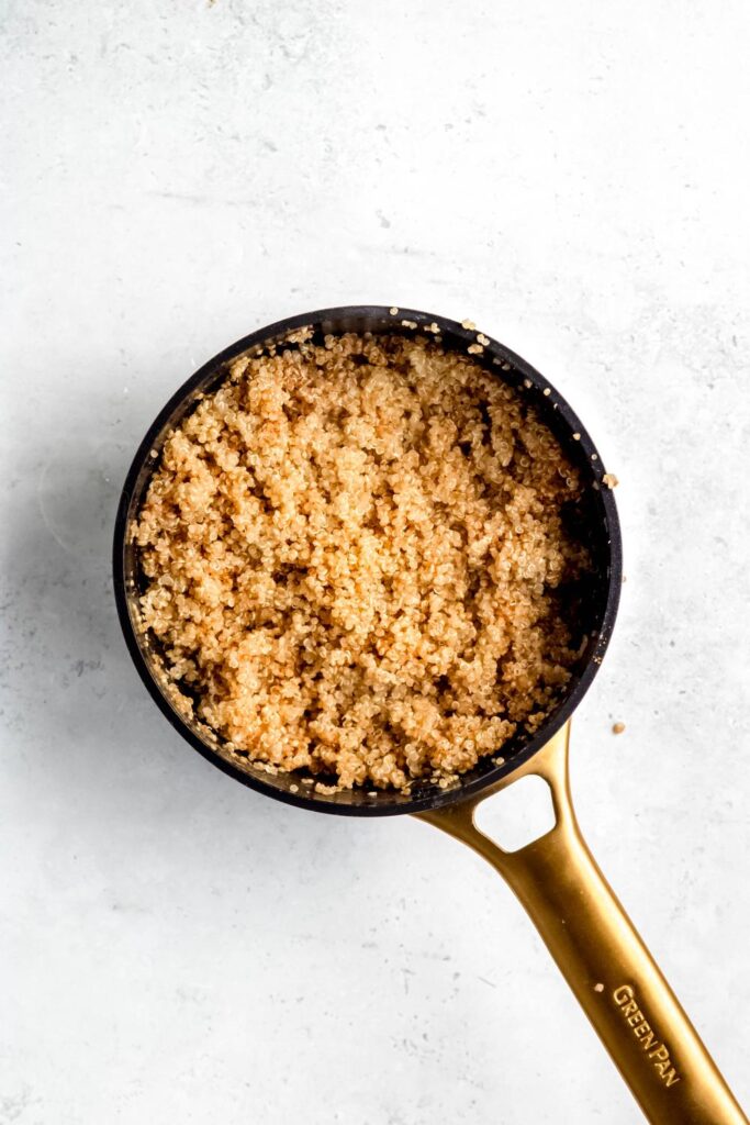 Fluffy cooked quinoa in pot