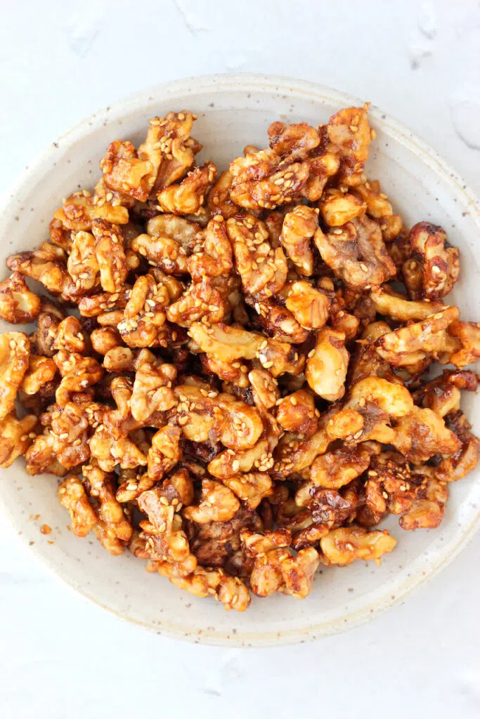 Close up of texture of golden brown crispy walnuts