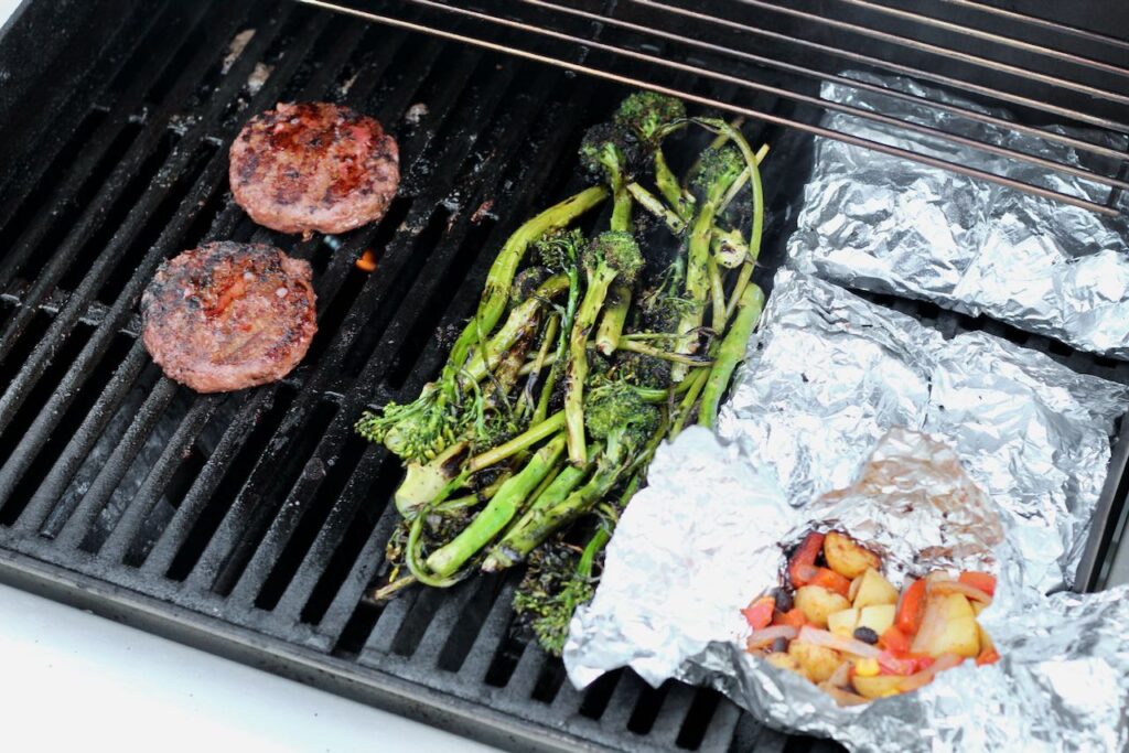 Grill out with burgers, broccolini, and potato foil packets