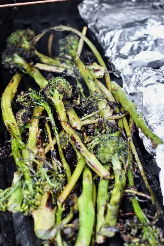 Grilled broccolini charred on barbecue grill with smokey flavor