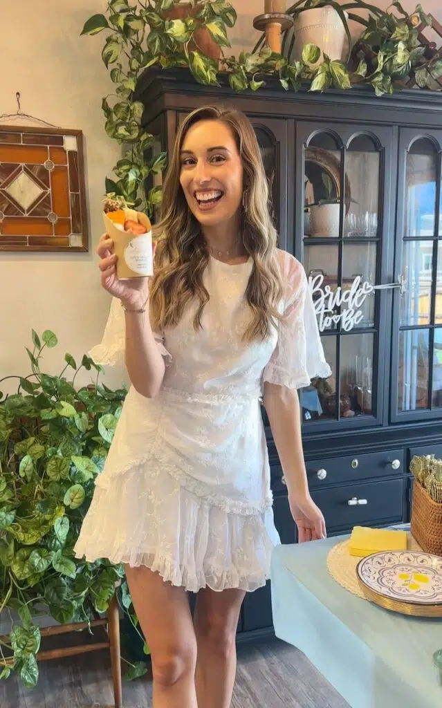 Mackenzie holding charcuterie cup at bridal shower