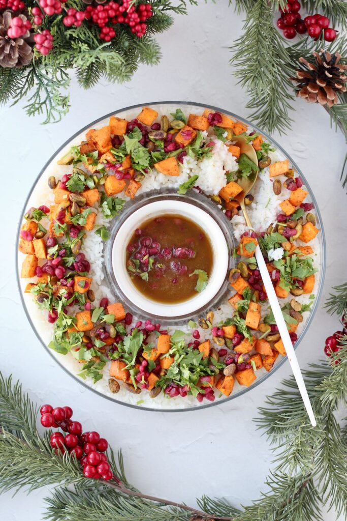 Festive rice wreath with sweet potatoes, pistachios, and pomegranate seeds.