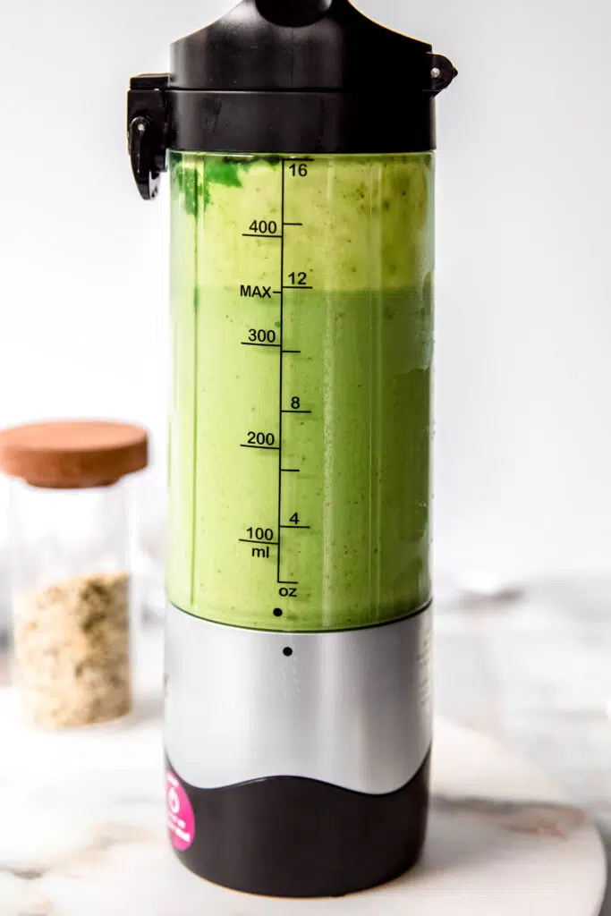 Finished bright green smoothie fully blended.