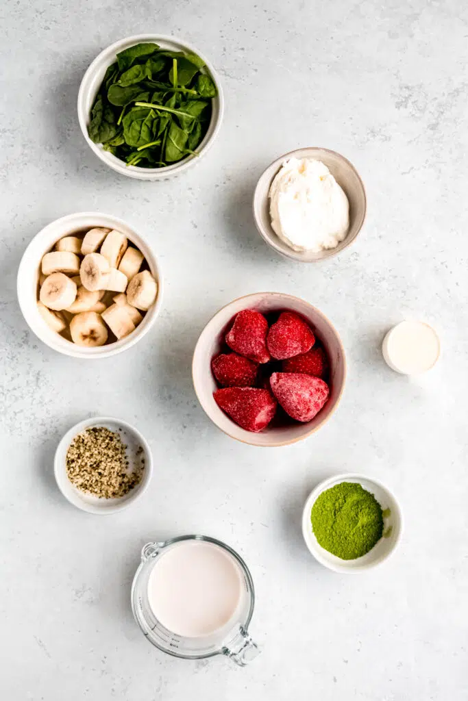 Smoothie Template — Build a Customizable Smoothie Ingredients: spinach, yogurt, banana, frozen strawberries, hemp seeds, protein powder, matcha, and milk.