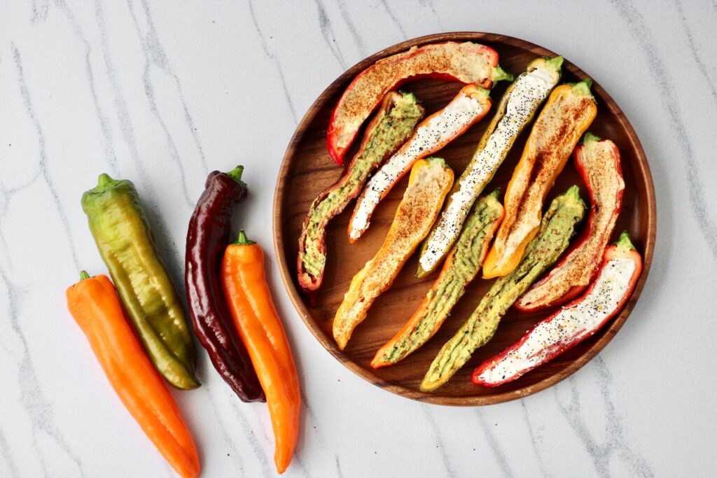 Vibrant stuffed mini sweet peppers topped with spices