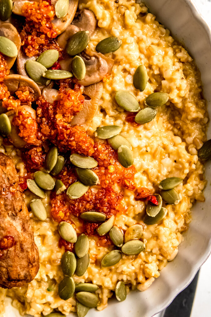 Savory oats with sausage links, mushrooms, and sunflower seeds.