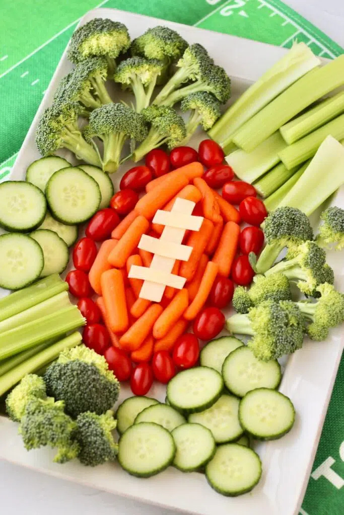 Creative veggie layout resembling a football for party