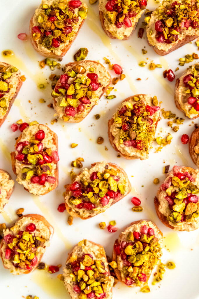 Pistachio and white bean crostinis on plate