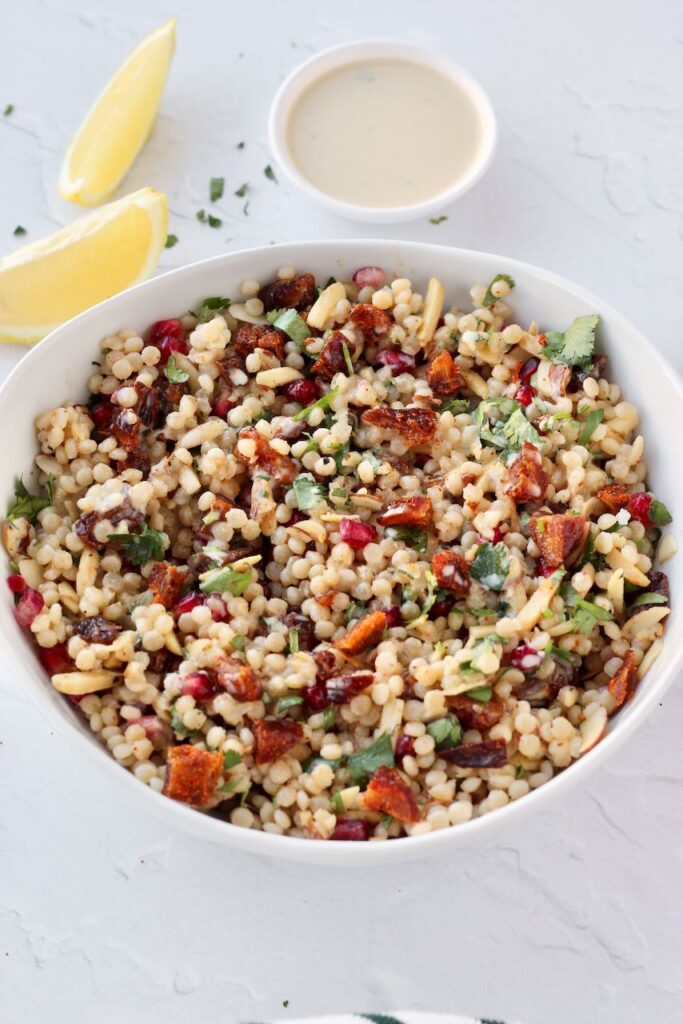 couscous salad with fresh lemon wedge 