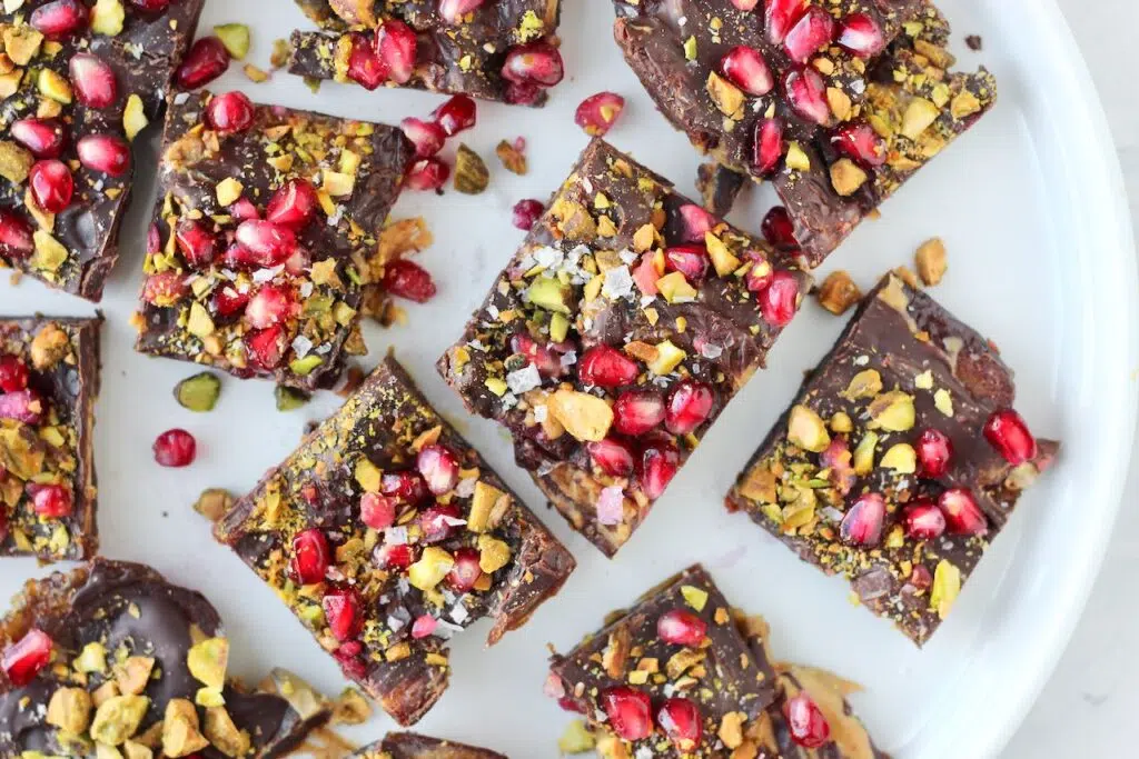 Holiday Date Bark topped with pistachios and pomegranate seeds