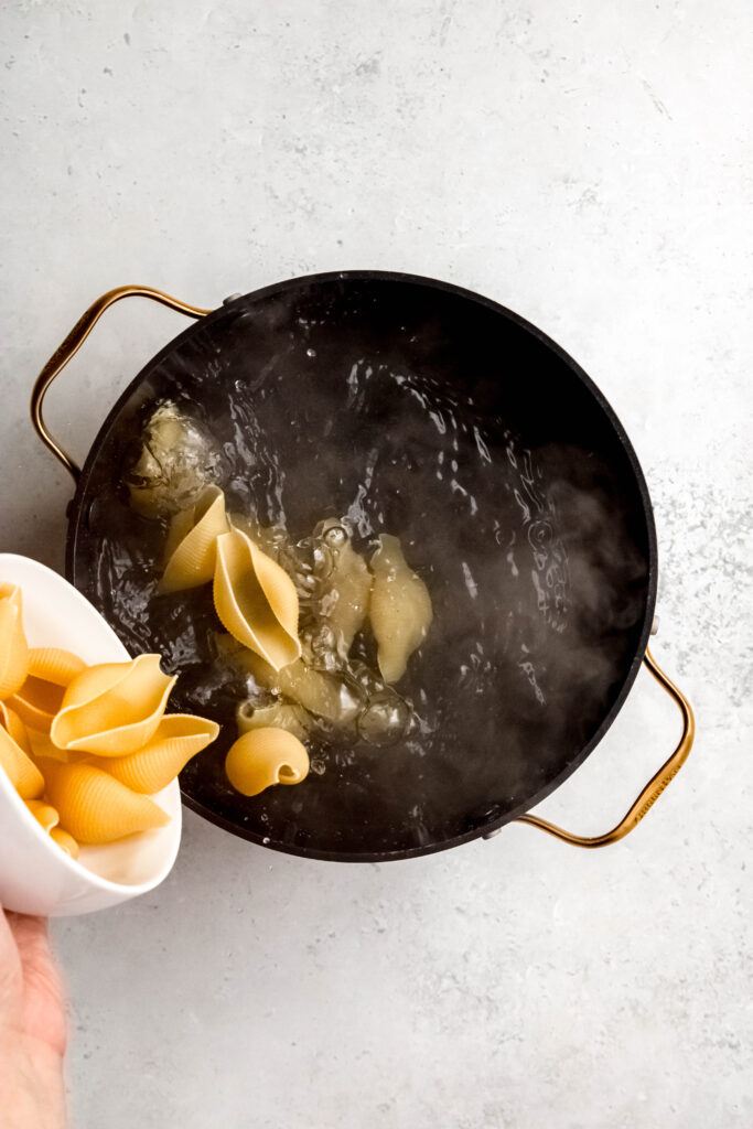 Pouring shells into boiling water